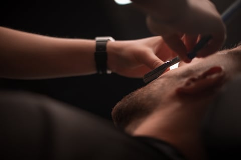 Close-up of straight razor shave